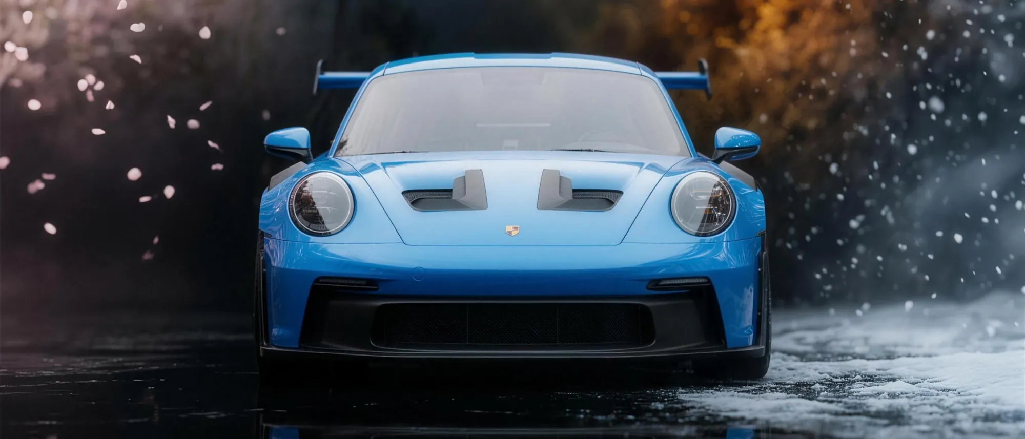 A blue sports car mirrored in wet asphalt against a backdrop of all four seasons