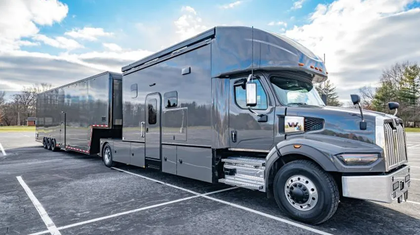 Heavy hauler and trailer parked in a yard