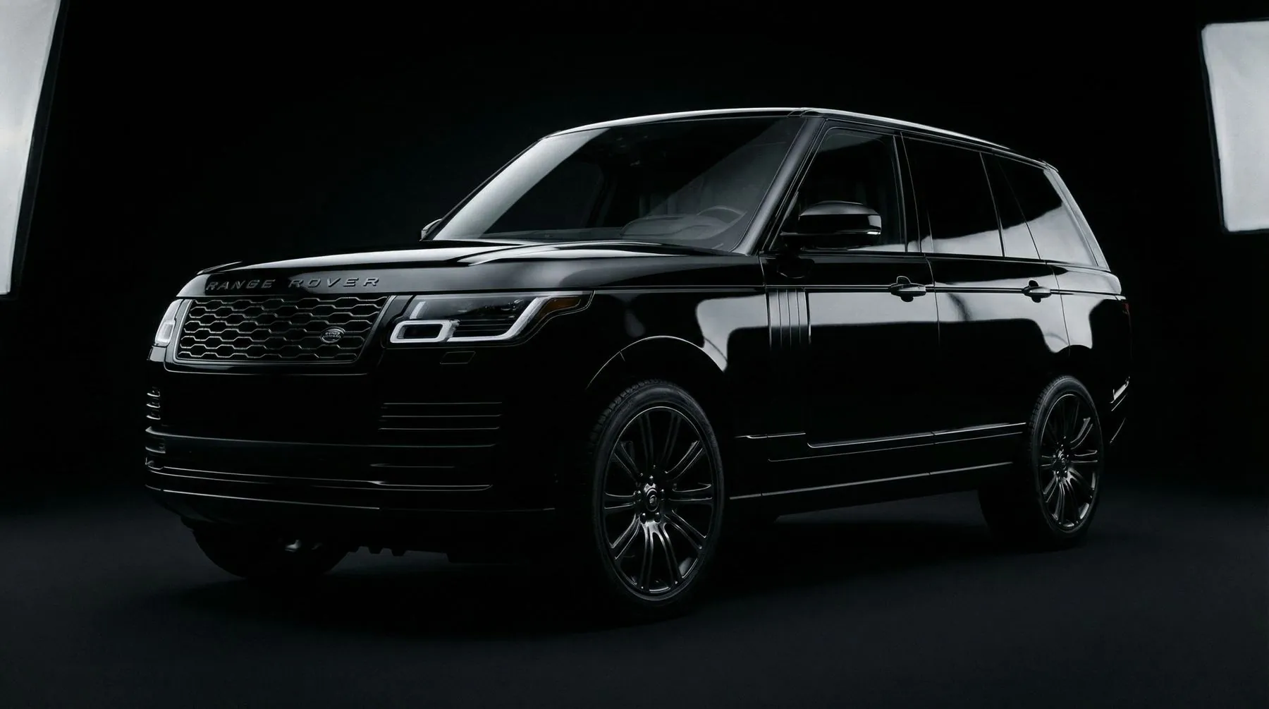 Black Range Rover finished with ICON Rocklear, three-quarter front in a dark studio